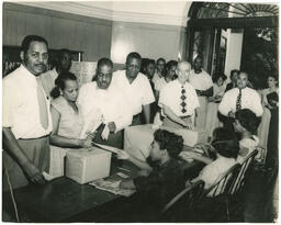 Dr. Clarence A. Bacote and Voters at Voting Site, circa 1958