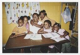 Carolyn Christian Surrounded by a Group of Children, 2007