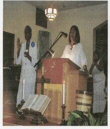 Rev. Yvonne McCoy Speaks from Behind a Podium, 2007