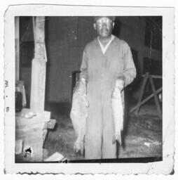 Man Holding a Fish, circa 1960