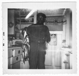 Rev. R.B. Shorts Holding a Fish, circa 1959