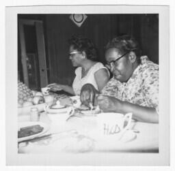 Two Women Sitting at a Dining Table, circa 1959