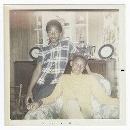 Two Boys Sitting in an Arm Chair, circa 1969