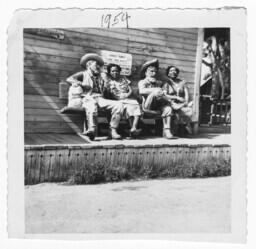 Women Sitting on Benches with Statues at Knott's Berry Farm, 1954