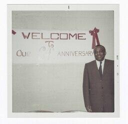 Man in Front of an Anniversary Sign, circa 1969