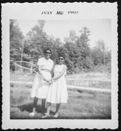 Two Women Holding a Landing Net, circa 1960