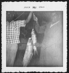 Men Holding Fish, circa 1960