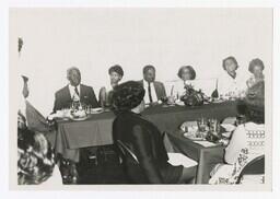 A Group of Men and Women at a Faculty Dinner, circa 1960