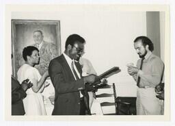 A Man With a Plaque at an Event, circa 1975