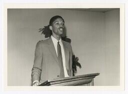 An Man at a Podium at an Unidentified Event, circa 1975