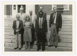 A Group of Men and a Woman, circa 1980