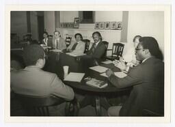 A Group of Men at a Table, circa 1980