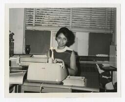 A Woman Seated at a Typewriter, circa 1960