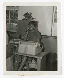 A Woman Answering a Phone, circa 1960