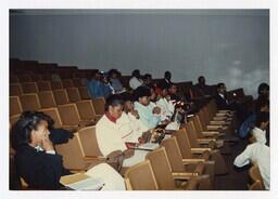 A Group of Men and Women in an Auditorium at an Admissions Orientation Event, circa 1985