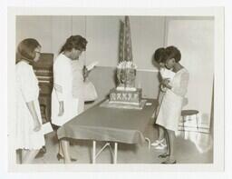 A Group of Unidentified Women with a Sculpture at an Art Exhibit, circa 1965