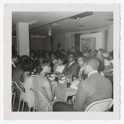 A Group of Men and Women at an Art Exhibit Dinner, circa 1965