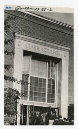 A Procession of Graduates Enter a Building at Commencement, circa 1965