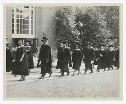 A Procession of Graduates at Entrance of Building at Commencement, circa 1965