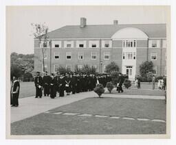 A Procession of Graduates at Entrance of Building at Commencement, circa 1965