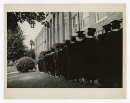 A Procession of Graduates at Entrance of Building at Commencement, circa 1965