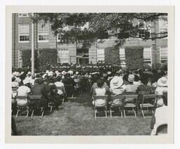 An Audience in Front of Building at Commencement, circa 1965