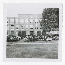 An Audience in Front of Building at Commencement circa, 1965