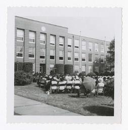 An Audience in Front of Building at Commencement, circa 1965