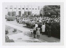 An Audience in Front of Building at Commencement, circa 1965