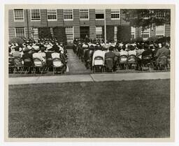 An Audience in Front of Building at Commencement, circa 1960