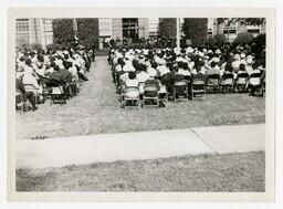 An Audience in Front of Building at Commencement, circa 1965