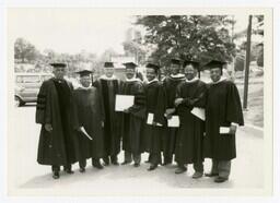 A Group Portrait of Eight Faculty Members at the Atlanta Civic Center at Commencement, circa 1975