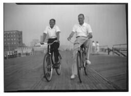 John H. Wheeler Riding a Bicycle, circa 1950