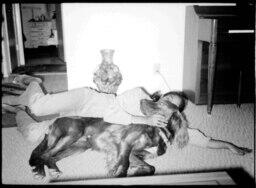 Girl Snuggling with Irish Setter, circa 1972