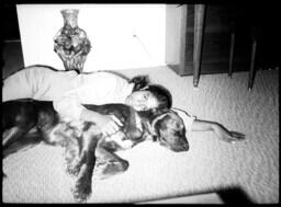 Girl Snuggling with Irish Setter, circa 1972