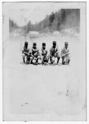 Five Baseball Players Crouched on the Field, circa 1942