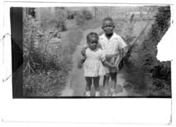 A Boy and Girl Stand Together, circa 1948