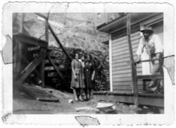 Group Standing Next to a House, circa 1942