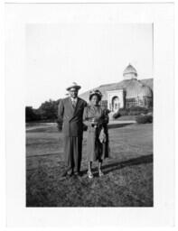 Couple Stand in Front of a Glass Building, circa 1942