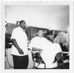 Martin Luther King Jr. at a Barbershop, October 1967