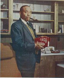 Dr. Edward A. Jones with Book, 1967