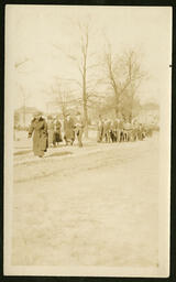 Group Walking Down Street, circa 1915