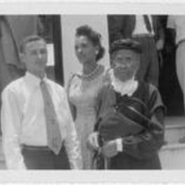 Anna E. Hall standing with unidentified woman and young man.