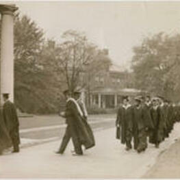 A line of faculty, students, and staff from the Atlanta University Center form a procession before the dedication of the Trevor Arnett Library. Written on verso: Faculties of the Atlanta University and other institutions in the city participated in the academic procession preceding the exercises of dedication of the new Atlanta University Library