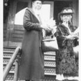 Anna E. Hall standing on steps with unidentified woman. Written on verso: Methodist conference Boston, MA April 1948. Anna Hall, Warner right (?).