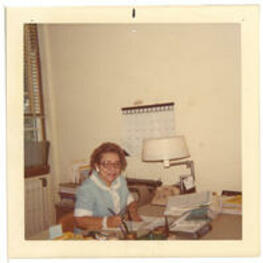 Virginia Lacy Jones works in her office. Written on Verso: Virginia L. Jones at work [ALISLIS?].