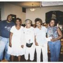 Five people standing in a line in front of a chapel altar. Written on verso: Vacation Bible School - 2007. (Left to right) Steve Stembridge, [Chanterria] Stembridge, Betty Harper, Gertha Tarver, Dr. Fransena Lewis.