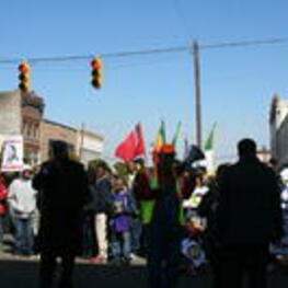 Demonstrators stand with signs, flags, and banners in Selma, Alabama as part of the annual Bridge Crossing Jubilee celebration.
