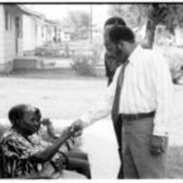 John R. Lewis meets with an old woman in Drew, Mississippi during a voting rights tour.