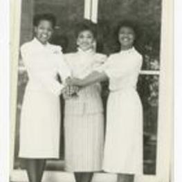 Group portrait of three women. Written on verso: "Miss Morris Brown College + Court 1986; L to R- Paige Wray 1st attendant, Iris Denise Jones- Miss Morris Brown College, Janet Curtis- 2nd attendent".